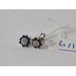A pair of sapphire and diamond cluster earrings 9ct