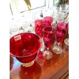 Set of four red glass etched flutes and a bowl