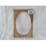 An oblong photo frame with oval aperture, 6.5" high