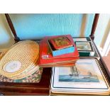 Four sets of boxed table mats
