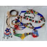 A bag of assorted ethnic bead necklaces etc.