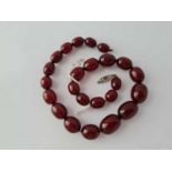 A row of red bakelite beads (A/F)