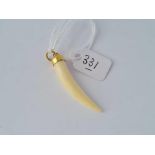 A large bone pendant with 18ct gold mount