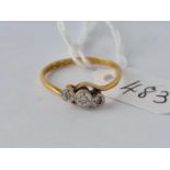 A three stone diamond ring, 18ct, Q