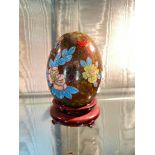 Cloisonne egg enamelled with flowers. 3.5" high excluding wood base