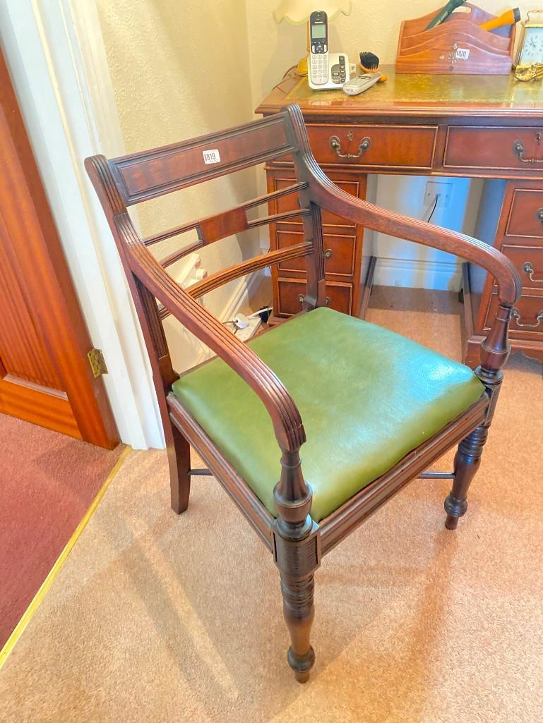 A Regency period mahogany elbow chair with stretcher base