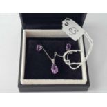A 9ct white gold amethyst necklace with matching earrings