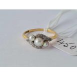 A diamond and pearl ring 18ct gold size o – 2.8 gms