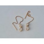 A pair of stone set pull through earrings14ct gold
