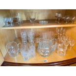 Two shelves of tumblers, wine glasses etc