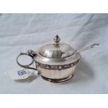 A 1953 silver Coronation mustard pot with Celtic style band spoon and blue glass liner –