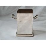 A square bottle holder with two lug handles – 3.5” high – Sheffield 1941 by FC – 154 g.