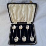 A boxed set of six bean top coffee spoons