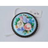 Antique circular silver mounted enamelled brooch with flower design, diameter 42mm