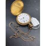 A gents rolled gold USA hunter pocket watch and silver albert with seconds dial W/O but no glass