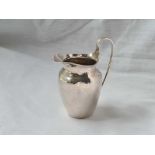 A plain cream jug with reeded loop handle – 3.5” high – Birmingham 1891 by SL – 64 g.