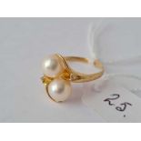 A pearl and diamond cross over ring 18ct gold size N – 3.2 gms