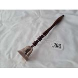 A candle snuffer with turned wood handle, London 1986