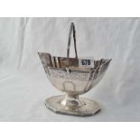 A Victorian sugar basket boat shaped with a pedestal base, 5.5” over handle, London 1885, 188 g.