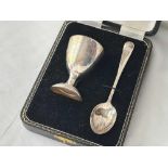 A boxed egg cup and spoon, London 1958