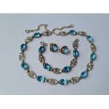 A silver and blue paste necklace/bracelet and earrings