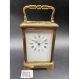 A French brass striking / repeat carriage clock by L Epie, 7" over handle