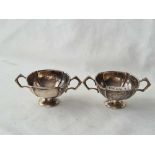A pair of two handled salts with ribbed sides, 3" over handles, Birmingham 1906, 55g