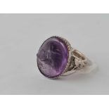 A vintage carved amethyst dog head set in silver ring size R