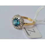 A blue zircon and diamond cluster ring 18ct gold size N 4.3 gms