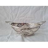 A heavy 19th Century Dutch bowl with pierced and cast sides and handles, 12” wide, Import mark 1905,