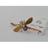 A Victorian insect brooch set with cabochon moonstone and cats eye 15ct gold