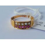 A attractive two row pearl and ruby ring 15ct gold size P 2.5 gms