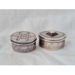 A marquise shaped patch jar and cover and another oval, 1.75” wide, unmarked