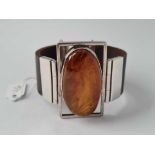 A contemporary amber and silver bracelet