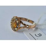 A oval citrine and pearl border ring (one pearl replaced) 9ct size R 2 gms