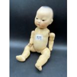 A Porcelain faced doll, the neck stamped AM Germany, 35312K