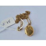 Oval rolled gold chased locket on chain