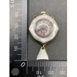 An unusual MOP fob watch, the reverse with cherub decoration