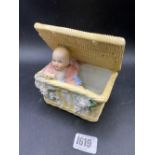 A Victorian Bisque figure of boy in a basket, 5" wide