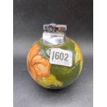 A W. Moorcroft cigarette lighter with label, 4.5” high