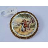 Victorian circular brooch set with a Limoges plaque of a scene of two lovers, signed ‘Limoges’.