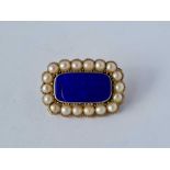 Victorian 15ct rectangular brooch set with pearls surrounding set with a blue enamel centre