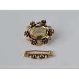 A gold pearl and blue stone small brooch and another gilt one