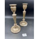 A pair of candlesticks with circular bases and V shaped stems, 5" high, Birmingham 1972