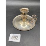 An Egyptian silver chamber candlestick with fancy rim, 3.3/4" diameter, 67g
