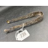 A good pair of early George III tongs with pierced arms by RP, circa 1775