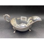 An oval sauce boat with gadroon rim and pad feet, 6.5" wide, Sheffield 1940, 122g