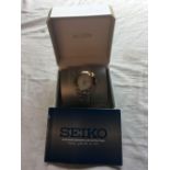 A gents SEIKO actura kinetic wrist watch with seconds sweep and date aperture as new original