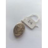 A Victorian oval chased back and front locket