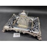An attractive early Victorian ink stand with pierced decoration and glass mounted ink pot, 7.5"